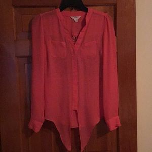 Pink blouse brand is candie’s.